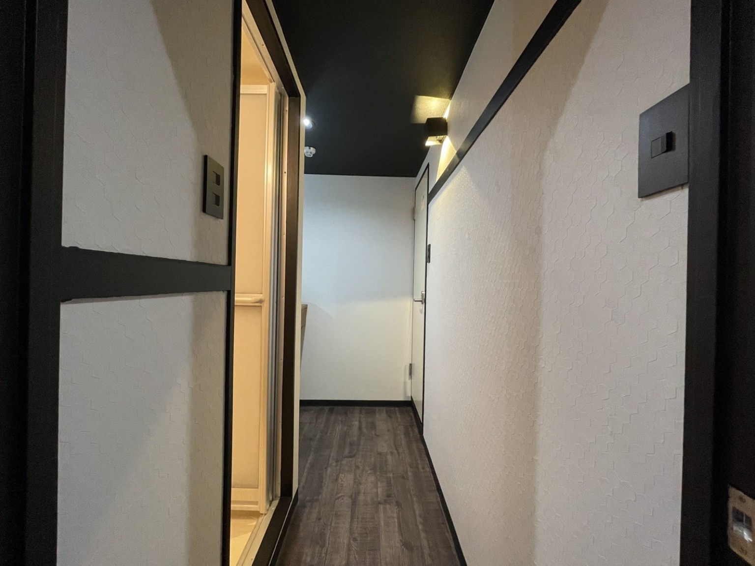 Hallway with dark floor