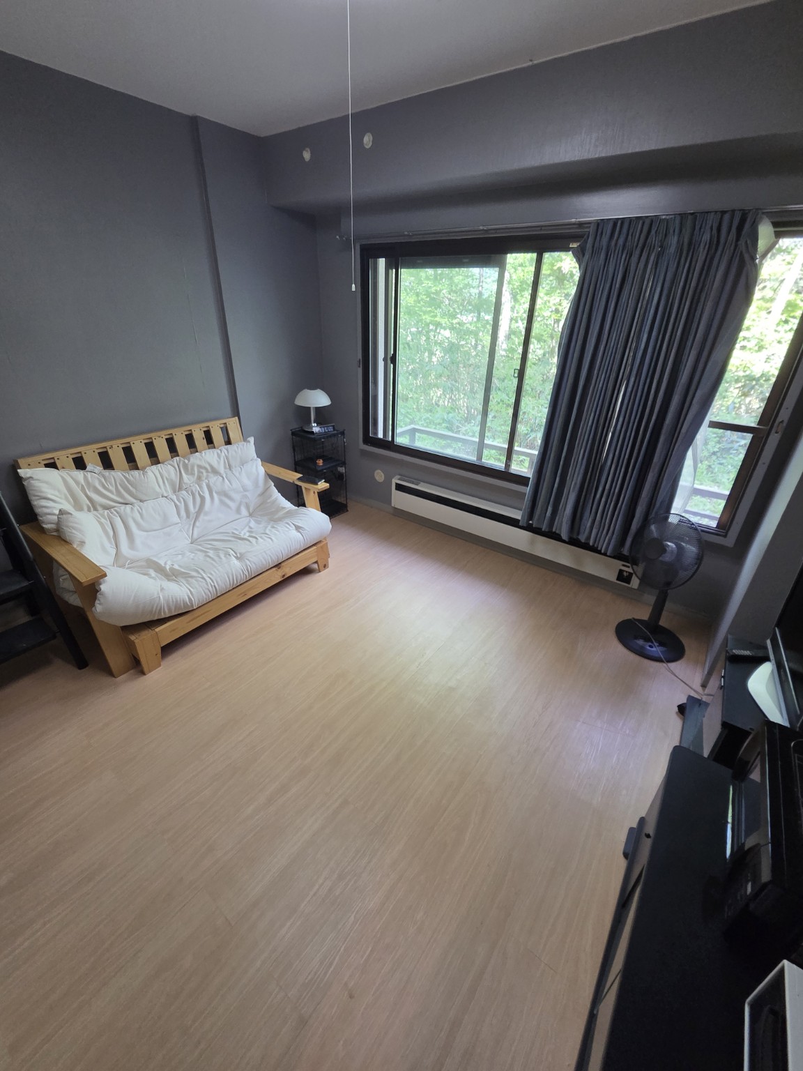Room 115 lounge with forest outlook